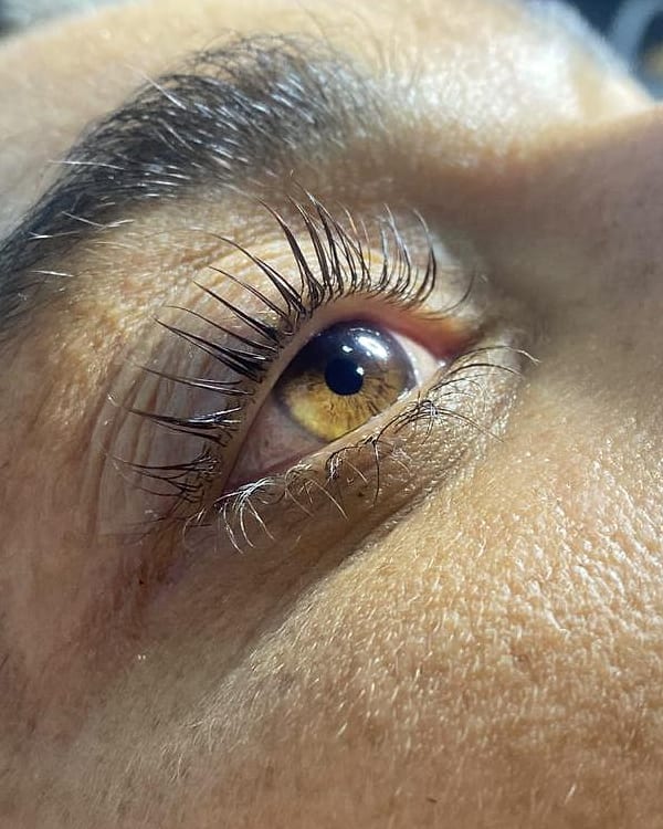 Close-up of lifted, curled natural lashes after a lash lift at Aurora