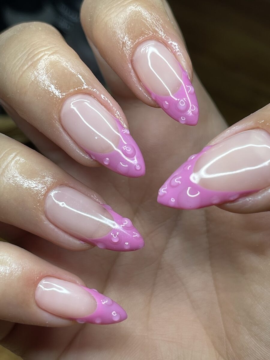 Nail art in pink French tips done at Aurora